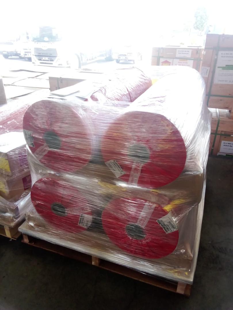 Regulated cargo rolls wrapped and secured on a pallet