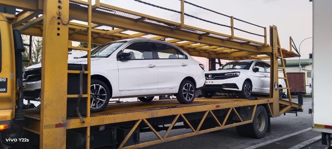 Vehicles secured on a multi-deck transporter
